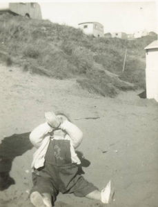 My younger brother learning to drink